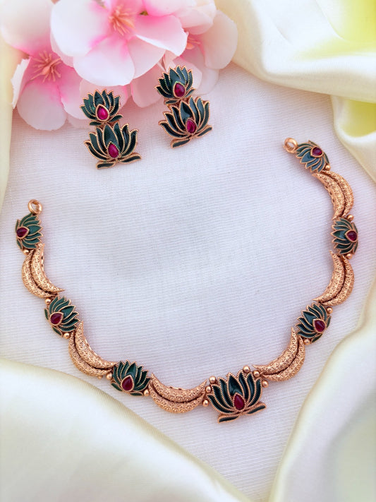 Beautifully crafted lotus motif matte finish necklace paired with matching earrings