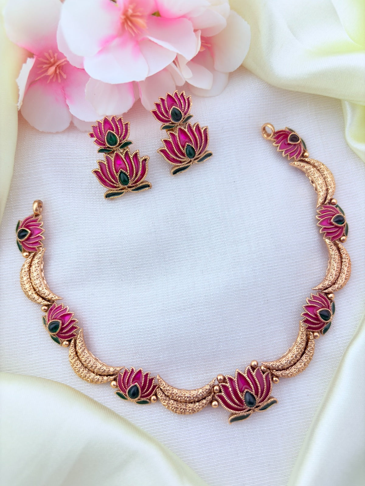 Beautifully crafted lotus motif matte finish necklace paired with matching earrings