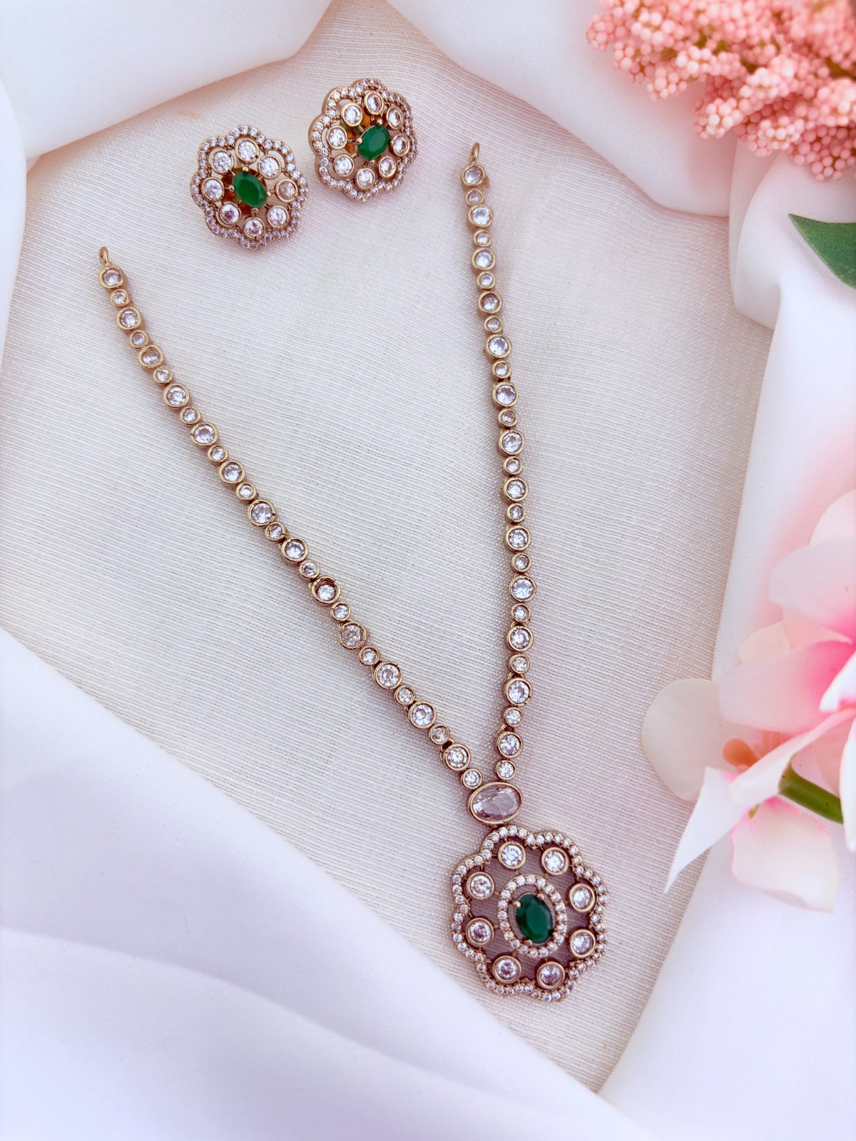 Elegant premium matte finish floral pendant necklace and matching earrings adorned wtih CZ stones