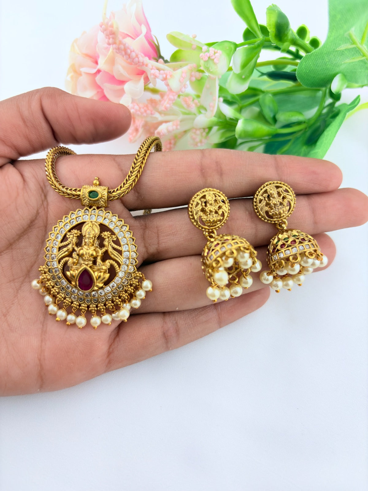 Traditional lakshmi pendant with matching jumkha beautifully designed with classic stones and pearl drops