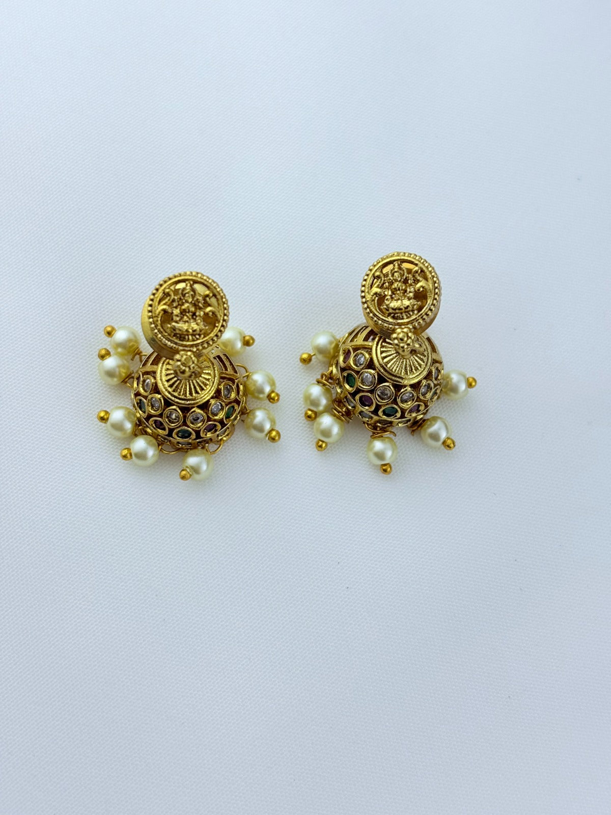 Traditional lakshmi pendant with matching jumkha beautifully designed with classic stones and pearl drops