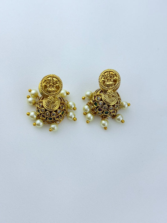 Traditional lakshmi pendant with matching jumkha beautifully designed with classic stones and pearl drops