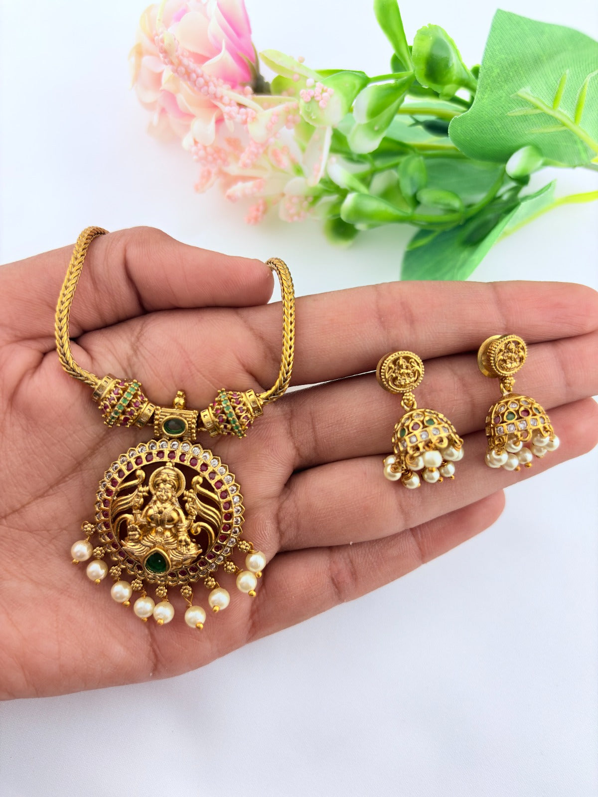 Traditional lakshmi pendant with matching jumkha beautifully designed with classic stones and pearl drops