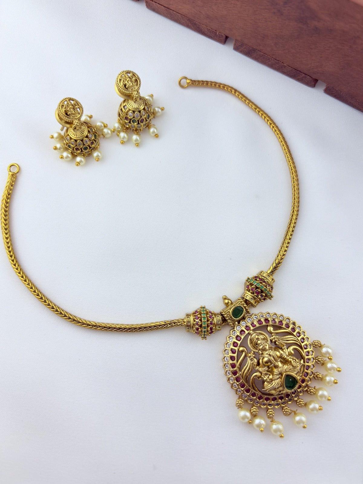 Traditional lakshmi pendant with matching jumkha beautifully designed with classic stones and pearl drops