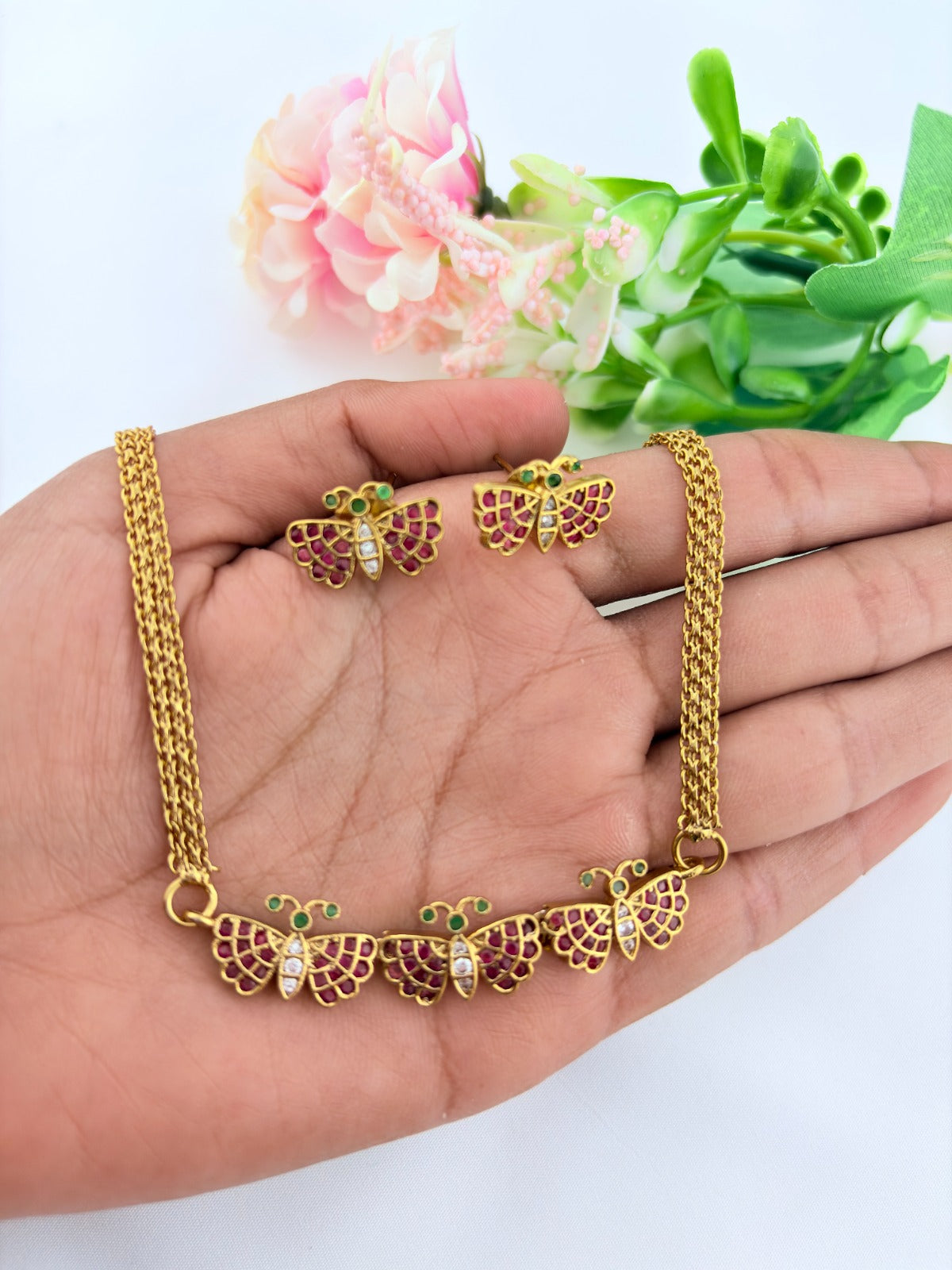 Premium matte finish butterfly necklace and matching stud with classic ruby stones