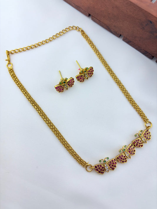Premium matte finish butterfly necklace and matching stud with classic ruby stones