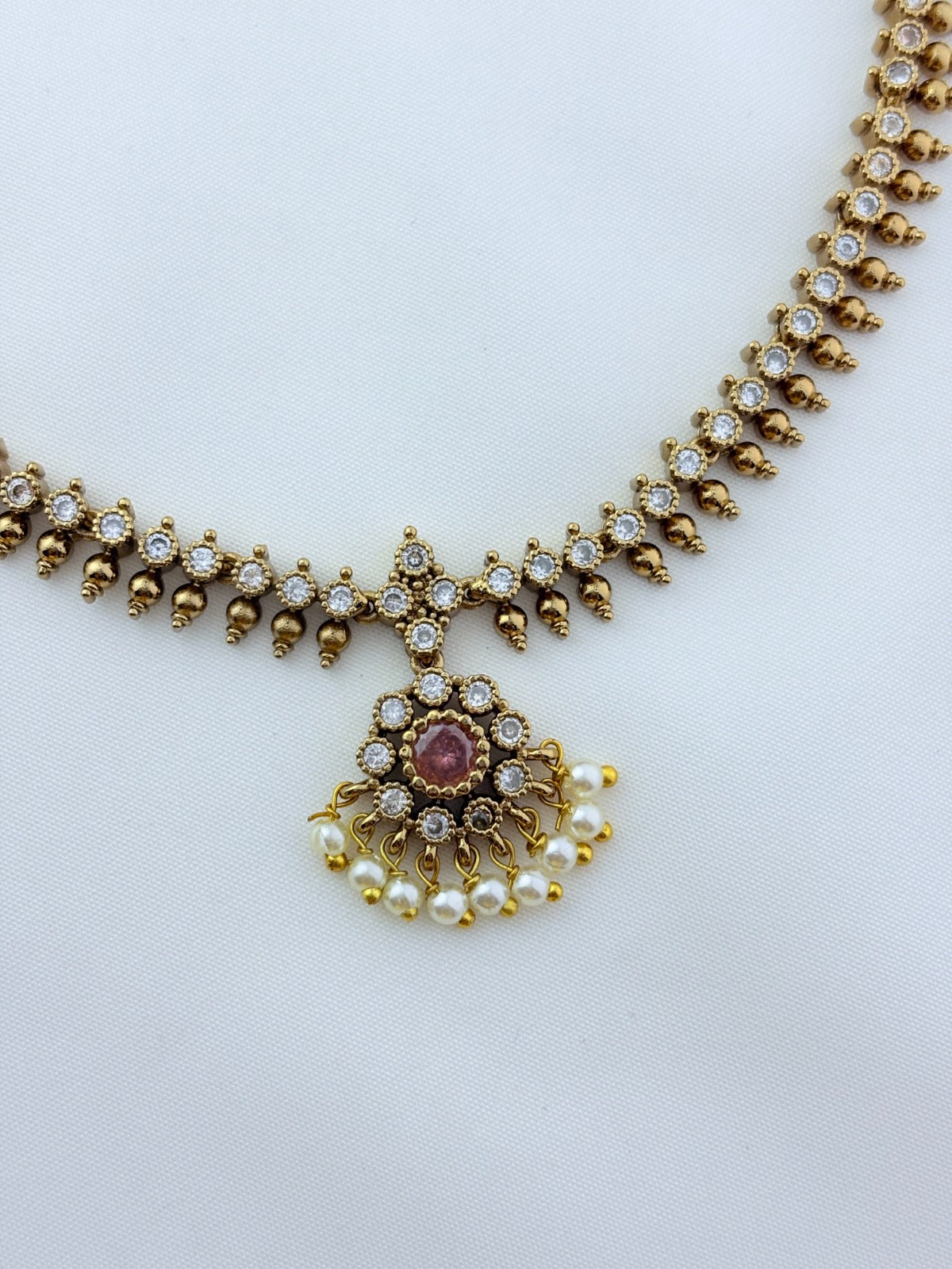 Premium matte antique polish AD necklace and earrings adorned with pearl drops