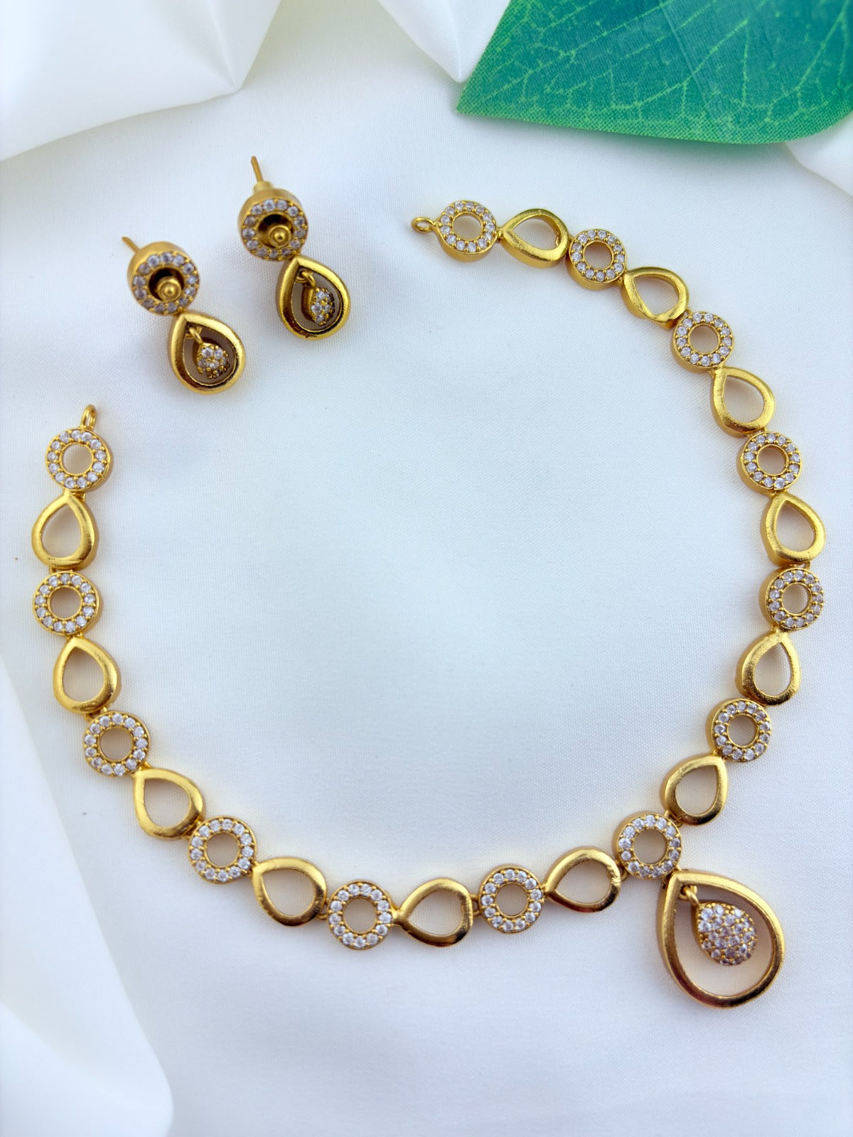 Stylish and elegance  adorned with AD stones - Premium matte finish necklace with matching earrings