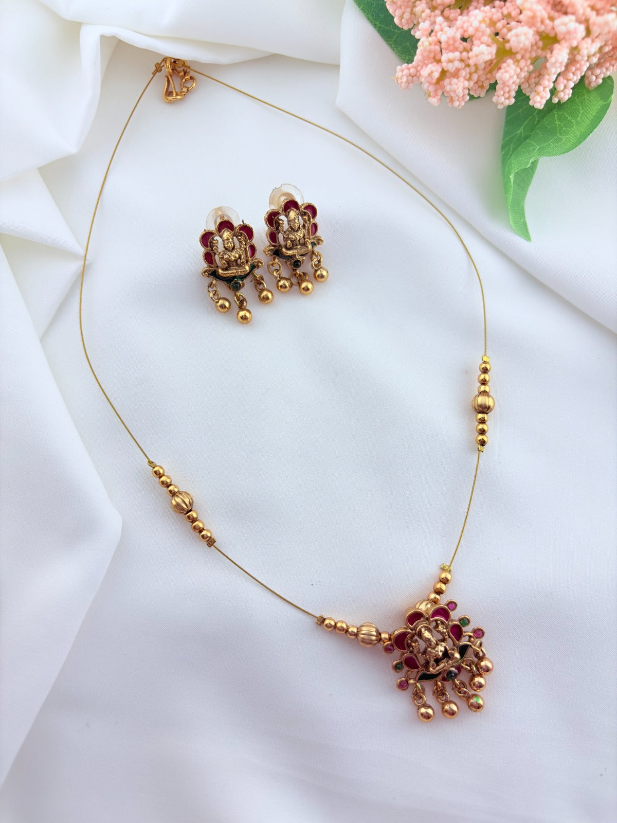 Trendy invisible chain with divine touch - Lakshmi pendant  and matching stud adorned with golden beads