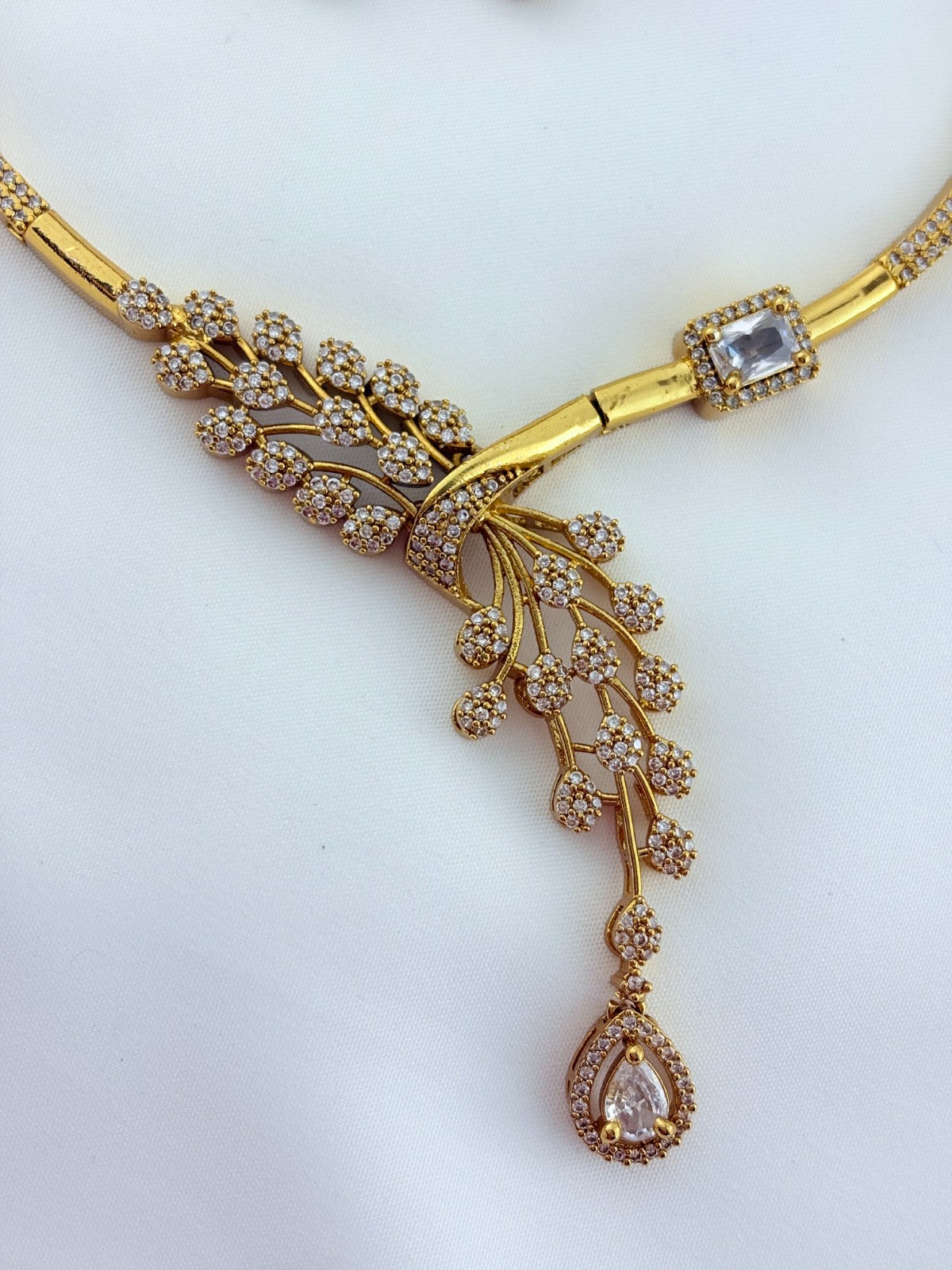 Premium hasli neckset crafted with classic AD stones - latest design with matching earrings