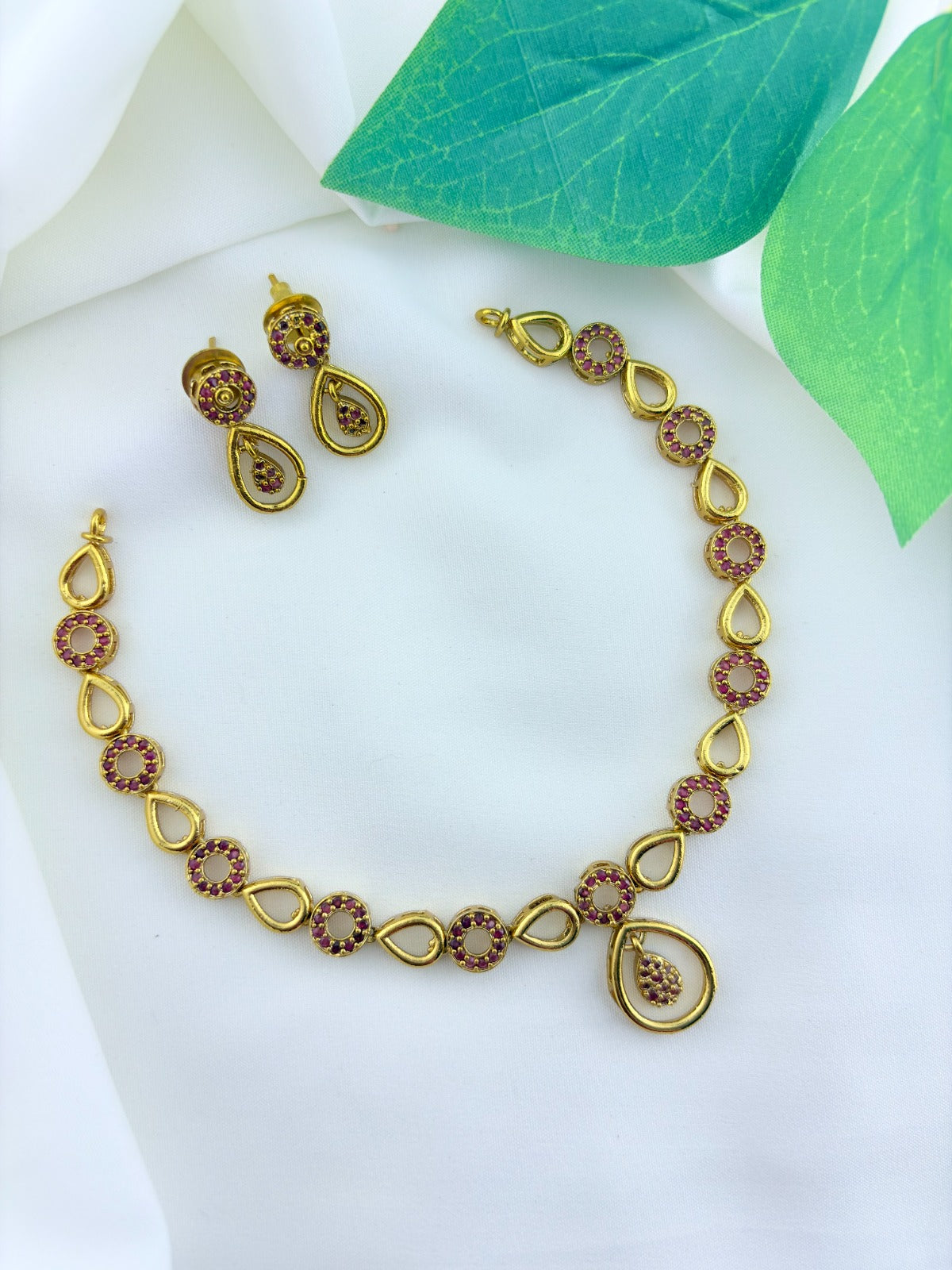 Stylish and elegance  adorned with AD stones - Premium matte finish necklace with matching earrings