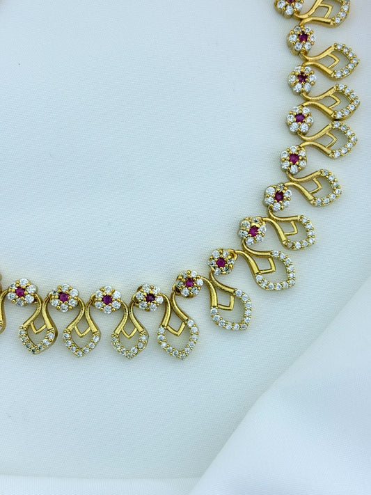 Premium matte finish necklace and earrings adorned with classic AD stones