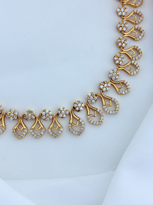 Premium matte finish necklace and earrings adorned with classic AD stones