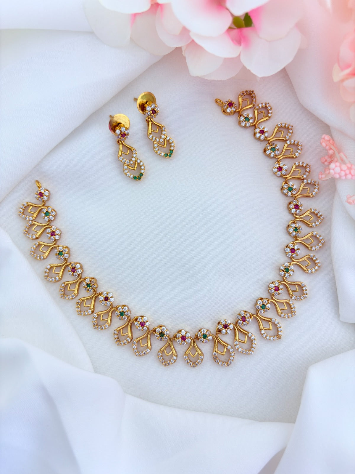 Premium matte finish necklace and earrings adorned with classic AD stones