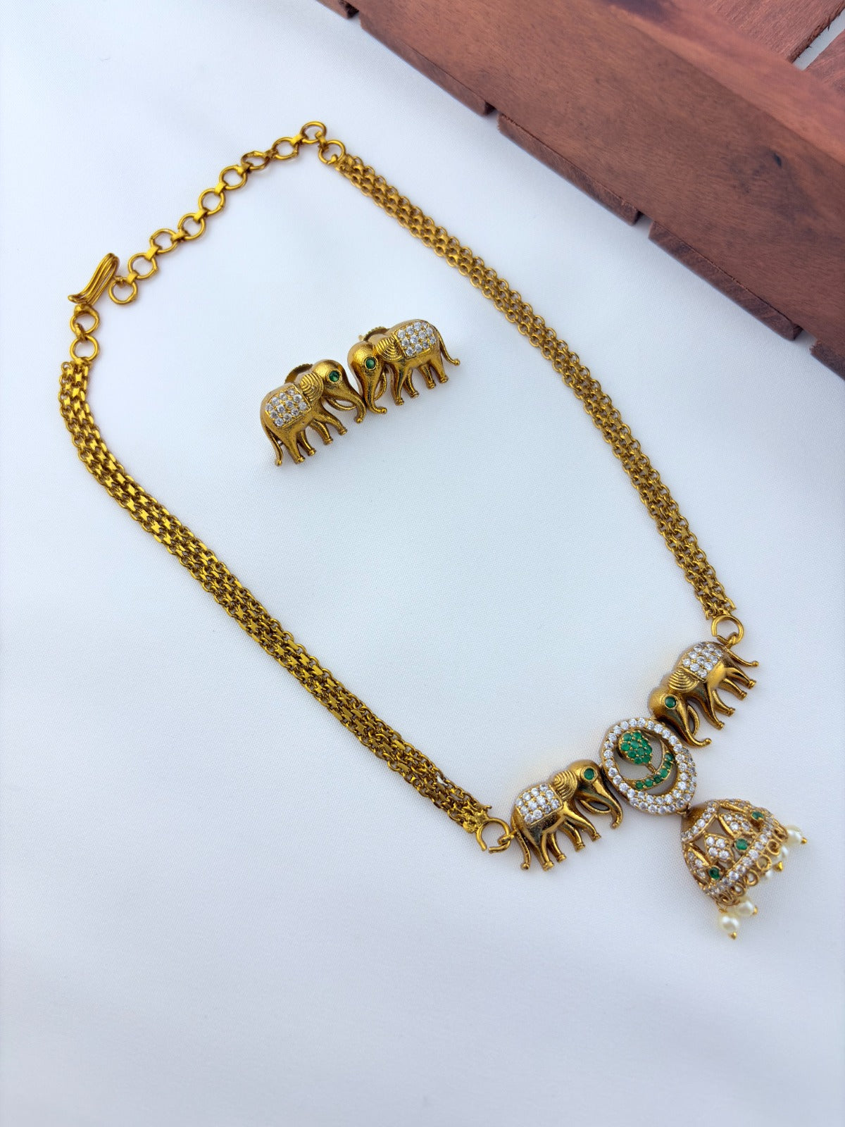 Premium matte finish Elephant motif necklace adorned with pearl drops