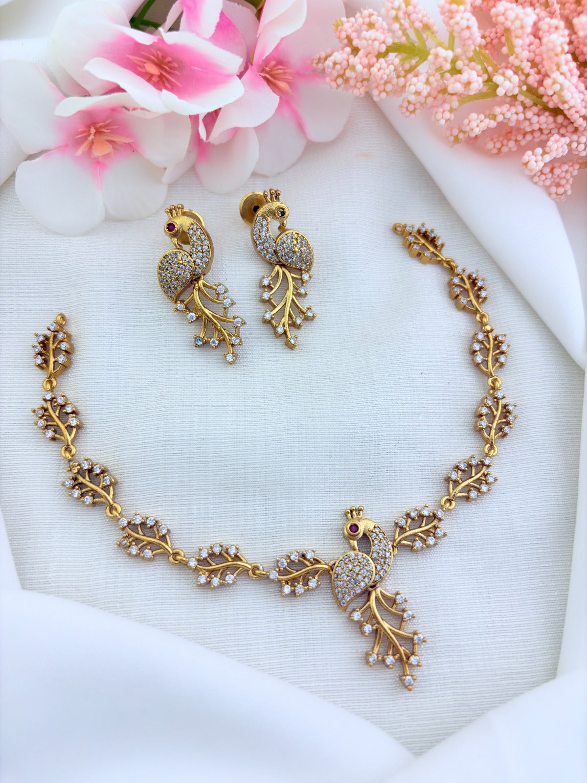 Stylish matte finish necklace featuring peacock design adorned with AD stones