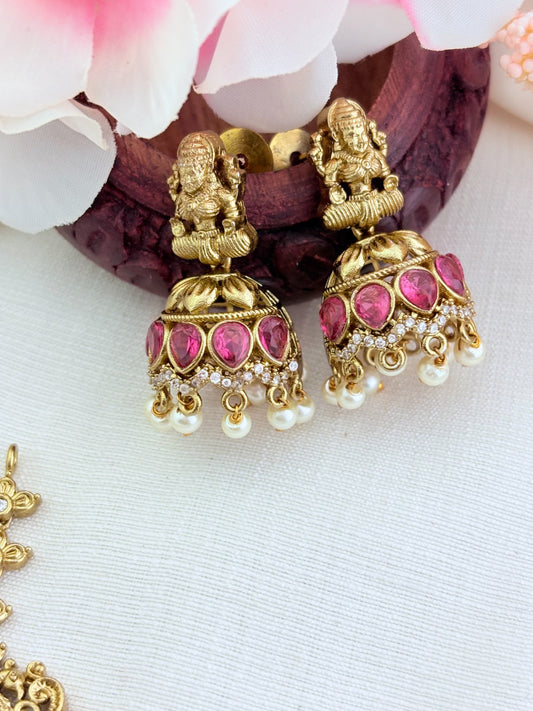 Premium matte finish Lakshmi pendant necklace beautifully crafted with classic ruby,green stones and pearl drops