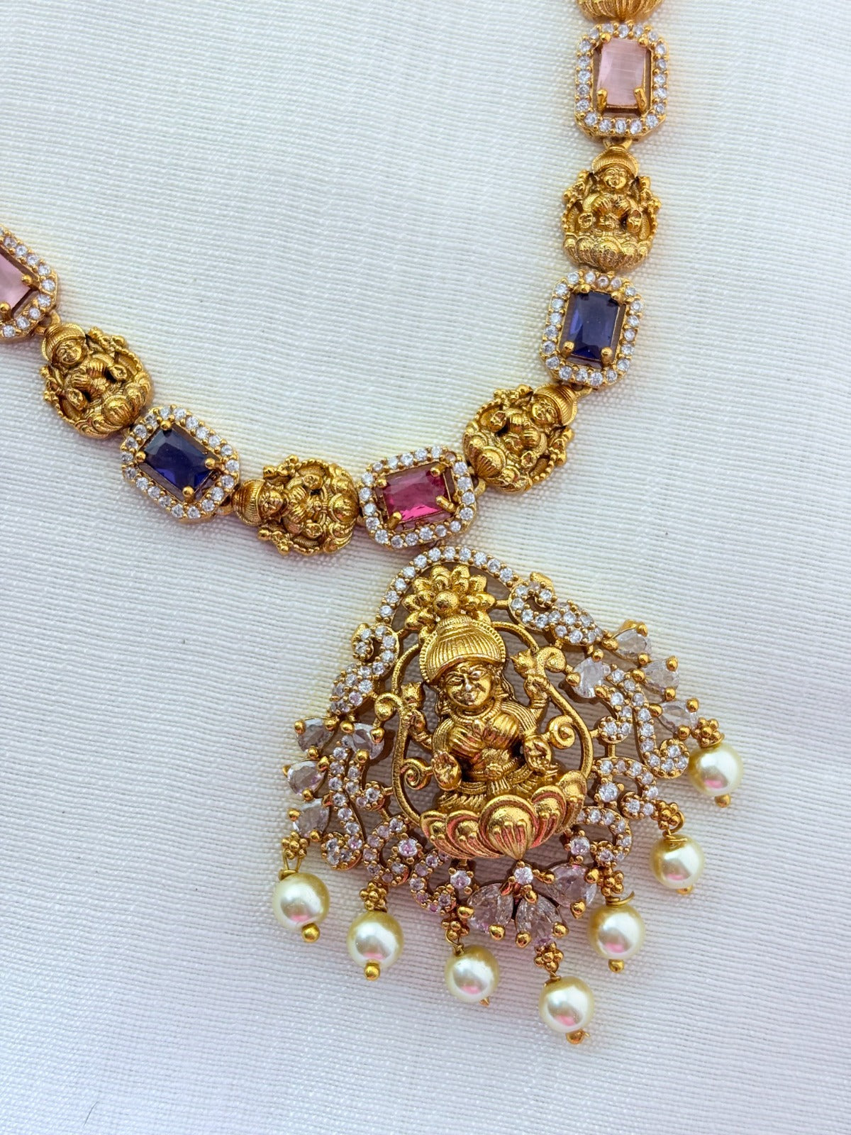 Temple jewellery - Premium matte finish Lakshmi pendant haram with stones and pearl drops