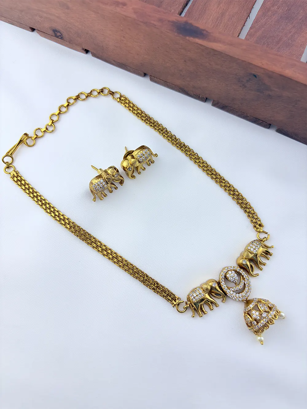 Premium matte finish Elephant motif necklace adorned with pearl drops