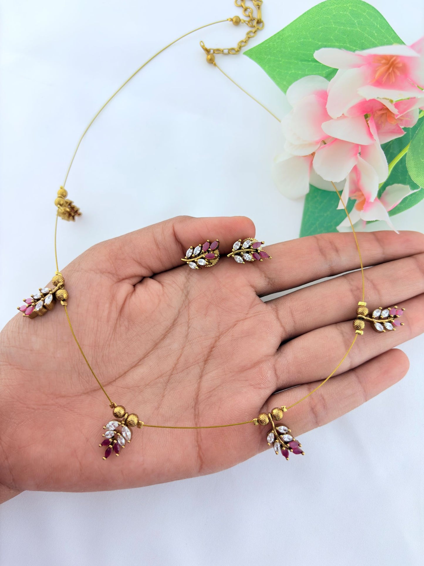 Premium invisible  chain adorned with AD stone leaf pendant