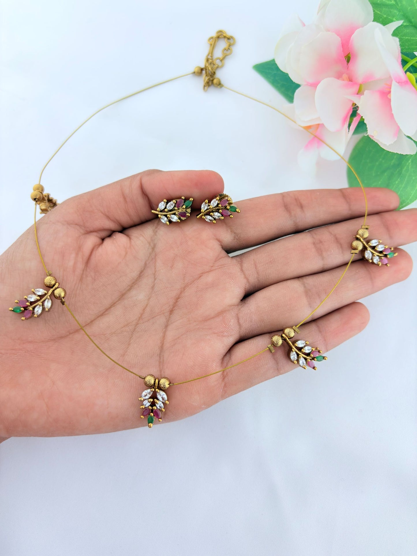 Premium invisible  chain adorned with AD stone leaf pendant