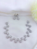 Floral Pattern AD stone neckset in premium silver polish with matching earrings