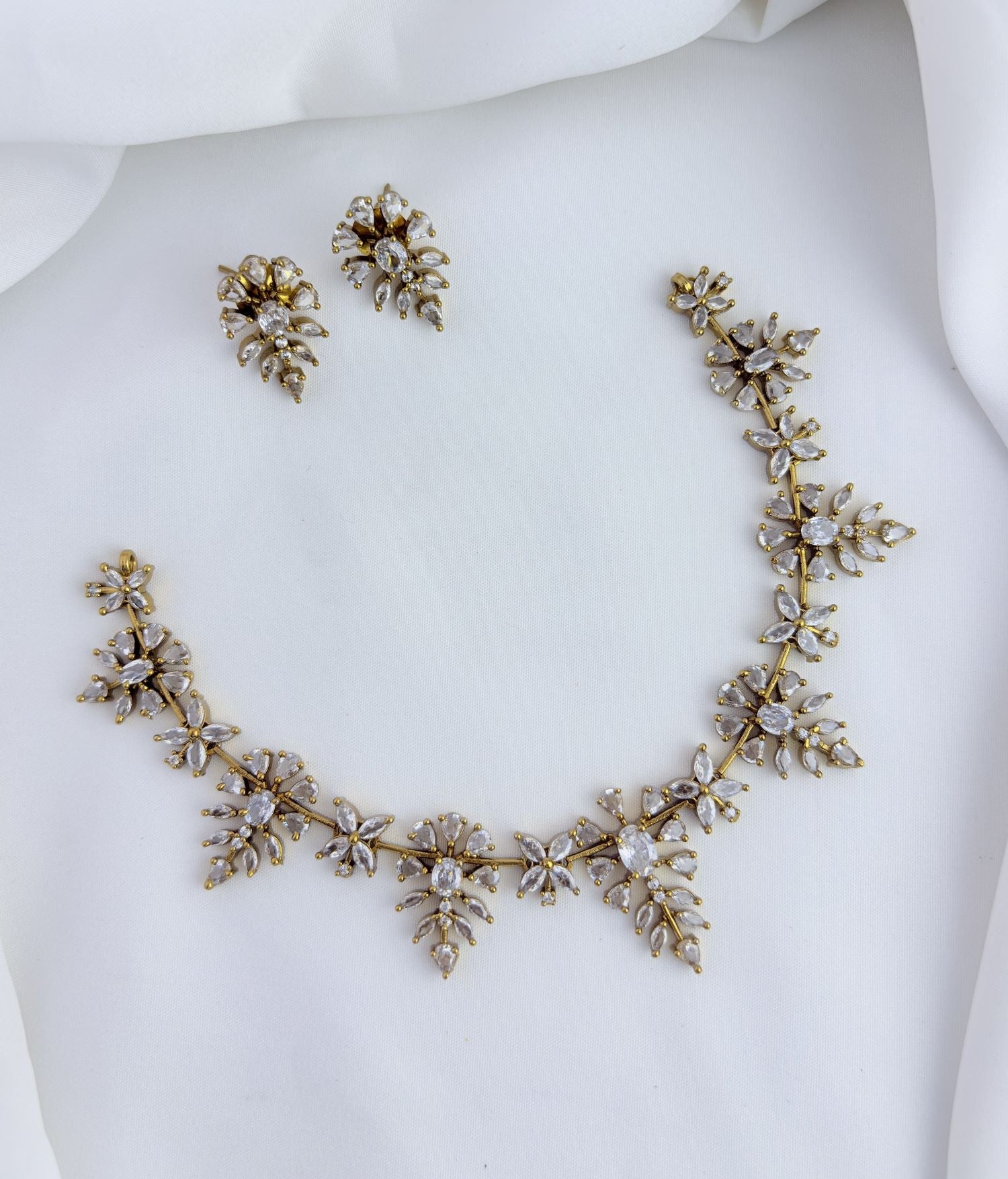 Sparkle with every step in this beautifully crafted CZ stone neckset.