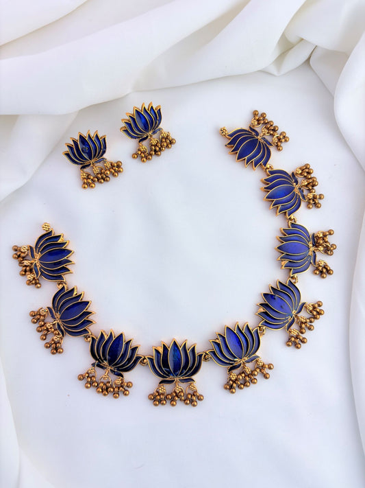 Elegant lotus design necklace set featuring intricate enamel work and matching earrings.