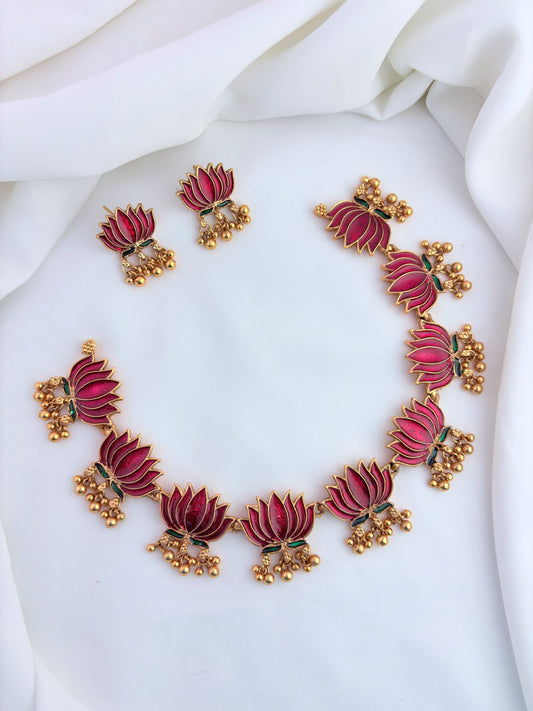 Elegant lotus design necklace set featuring intricate enamel work and matching earrings.