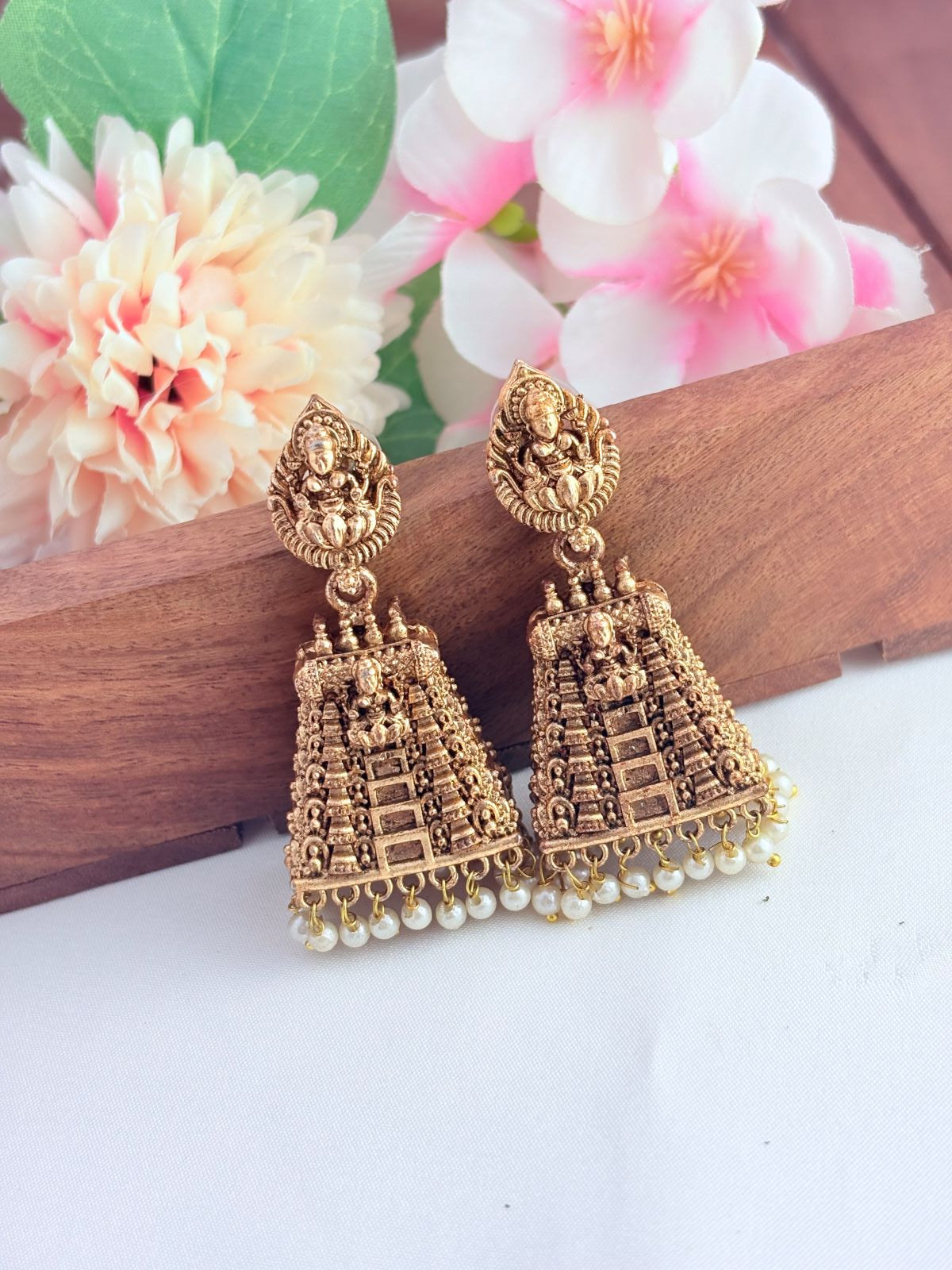 Traditional gopuram jhumka in matte finish beautifully crafted with pearl drops