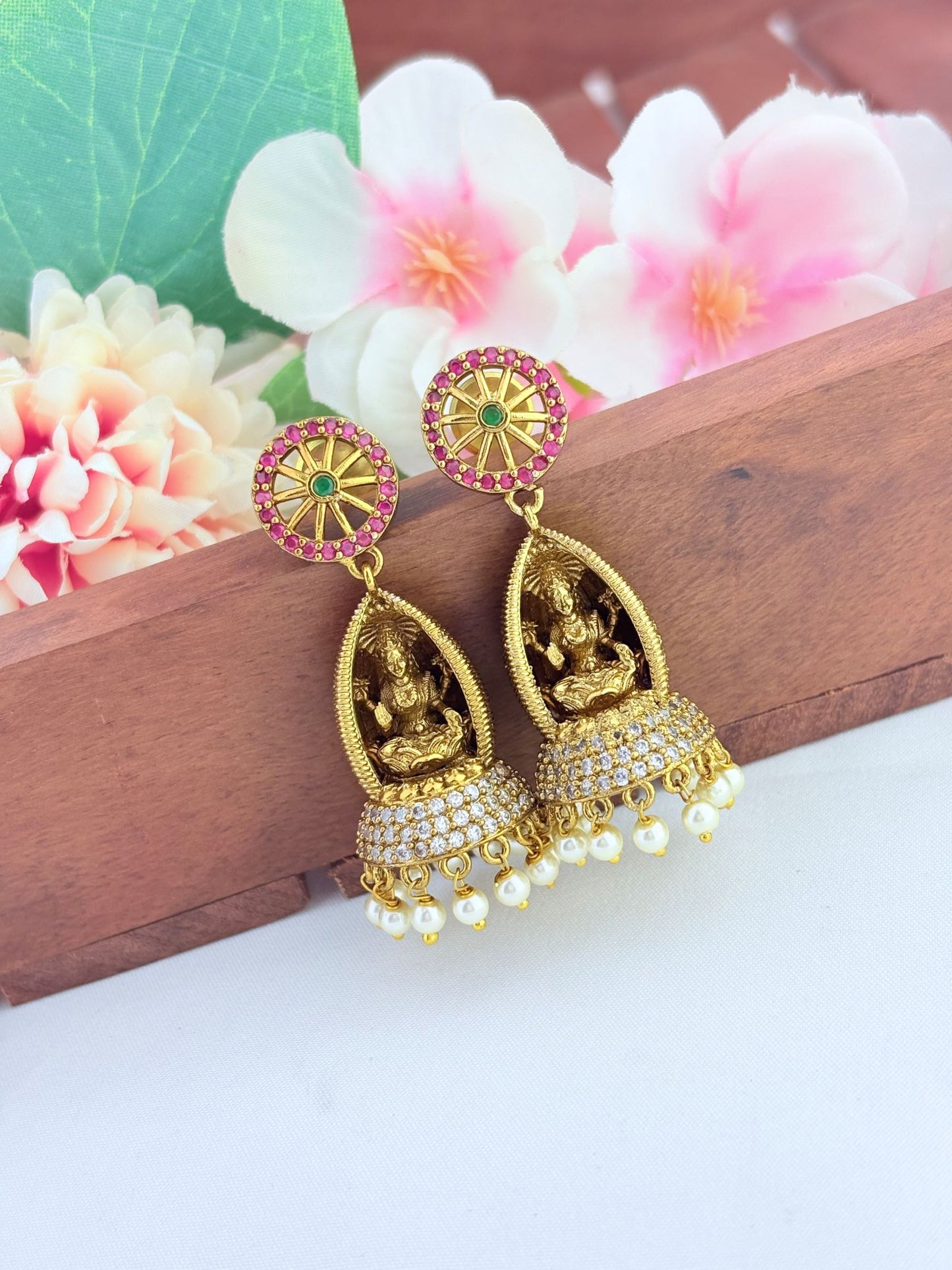 Gracefully crafted Lakshmi jhumkas for festive wear.