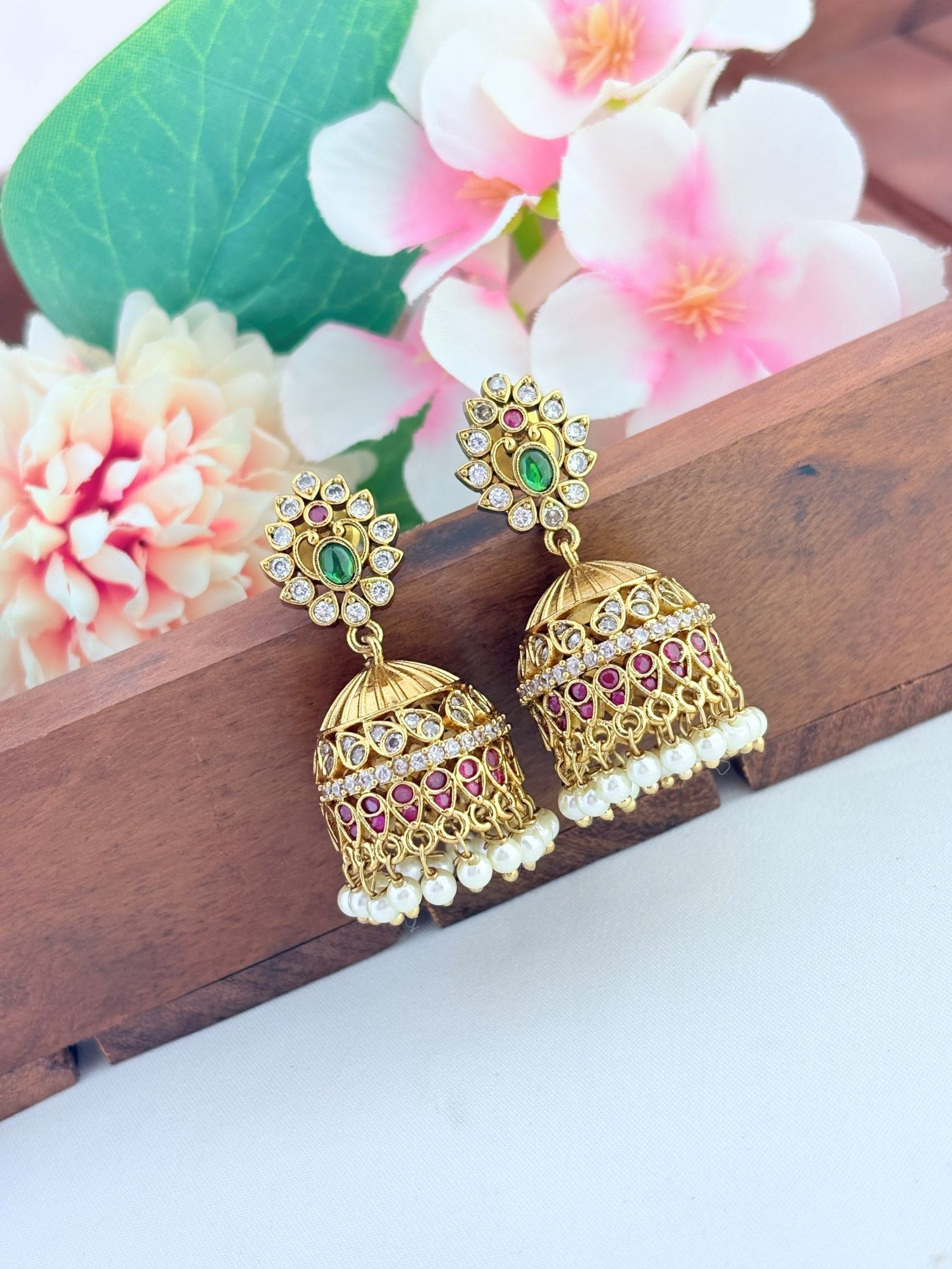 Premium AD stone jhumka beautifully crafted with pearl drops