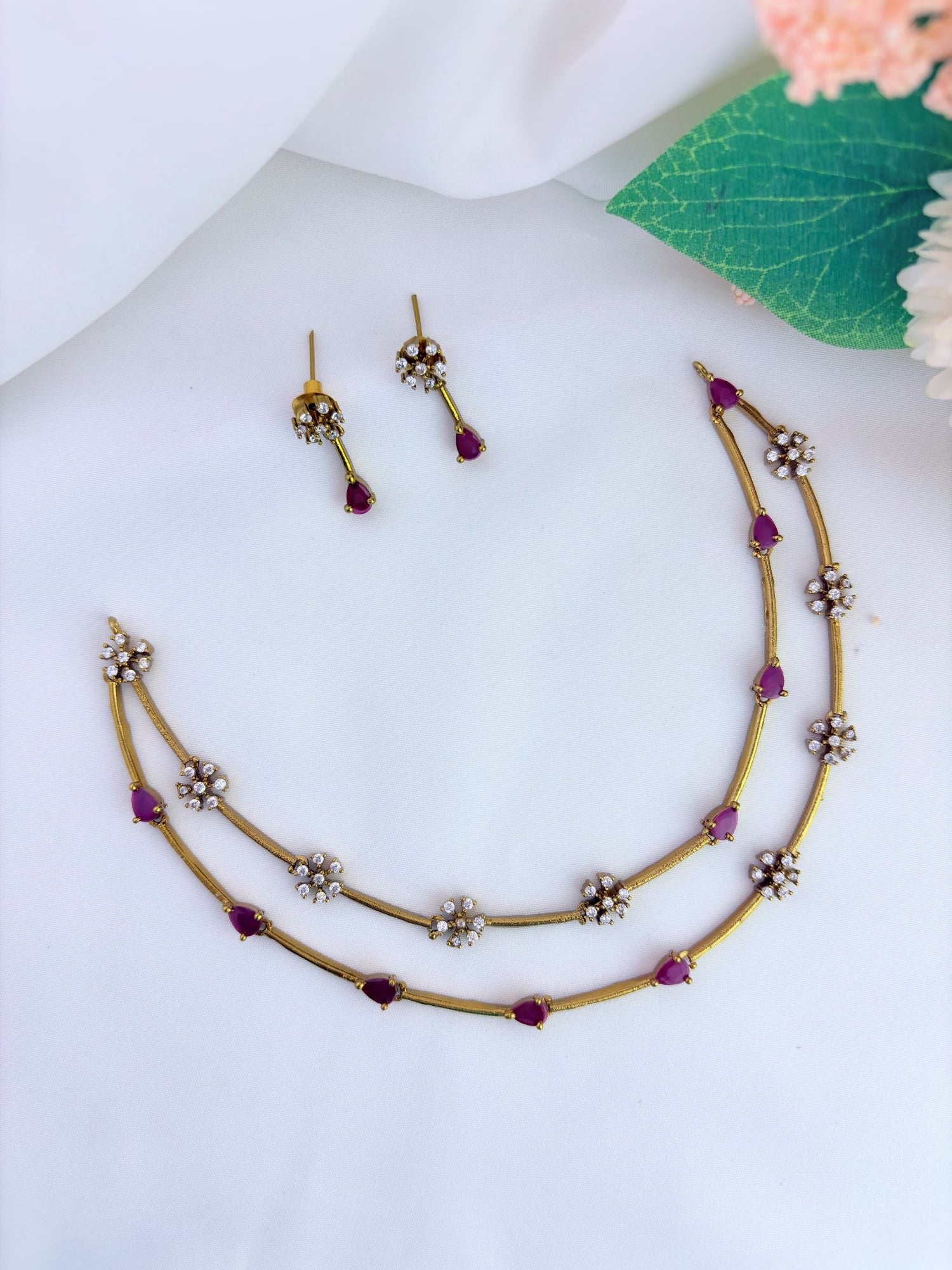 Premium matte finish jewellery designed with elegant craftsmanship adorned with AD stones - Ruby