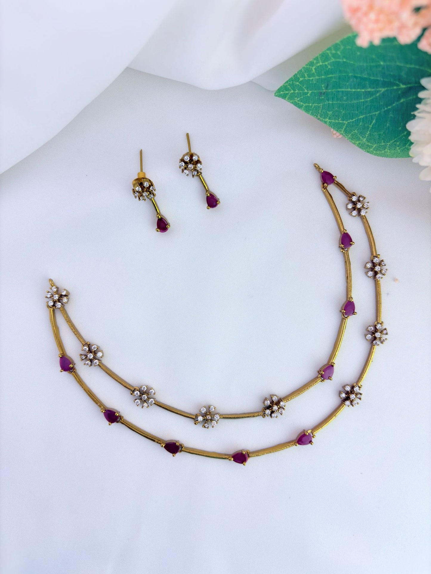 Premium matte finish jewellery designed with elegant craftsmanship adorned with AD stones - Ruby