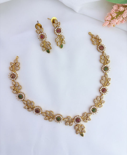 Classic leaf and floral pattern in premium matte finish adorned with AD stones