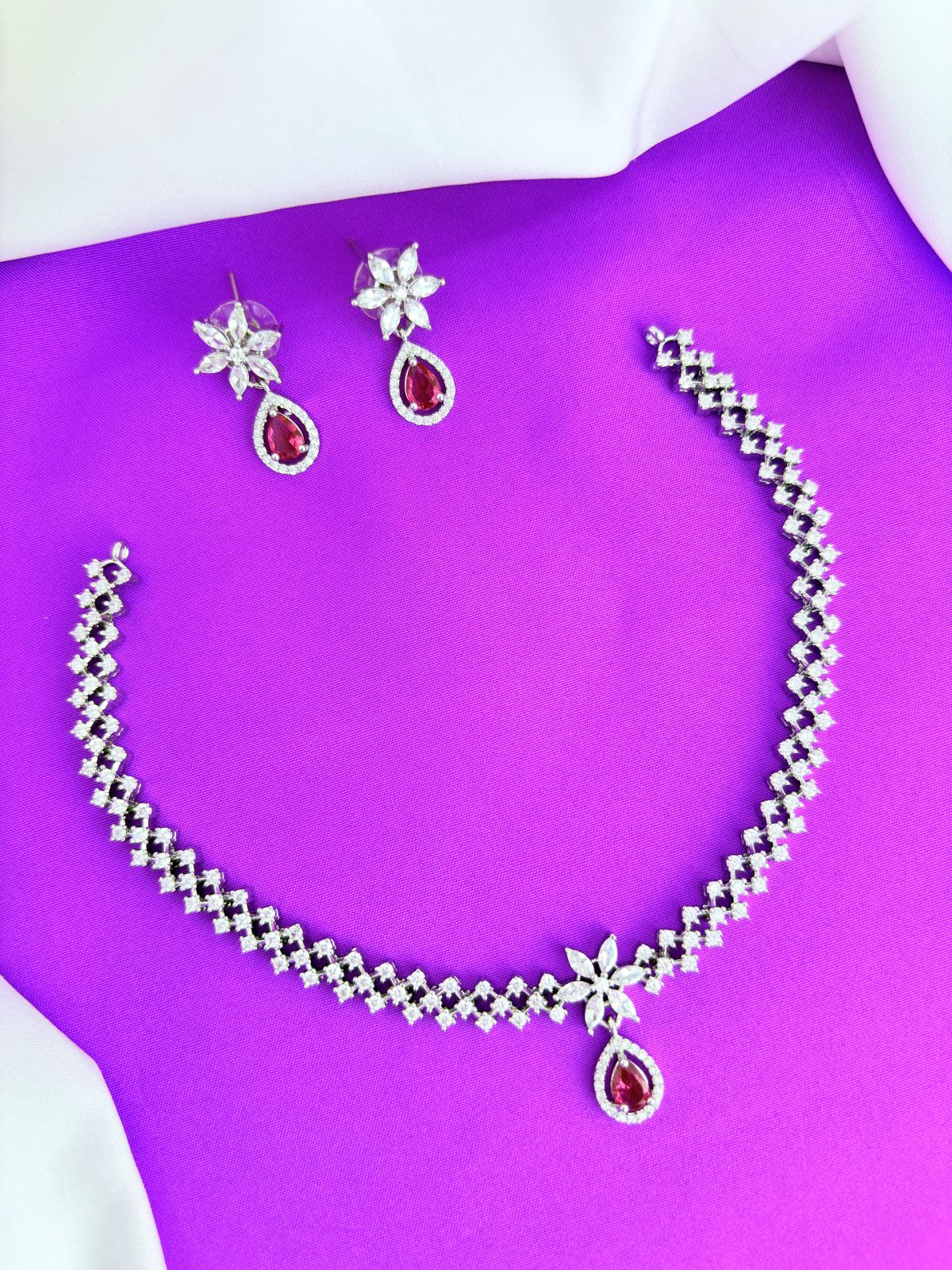 Elegant premium AD stone necklace paired with matching earrings in silver finish