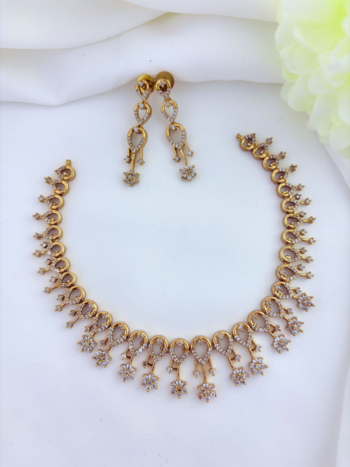 Stylish pattern premium matte finish neckset and earrings beautifully adorned with AD stones