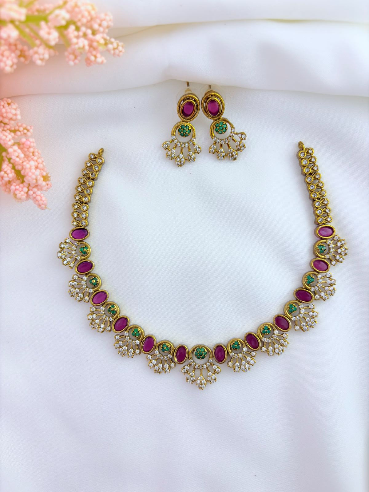 Premium matte finish AD neckset and earrings beautifully crafted wtih ruby and green stones