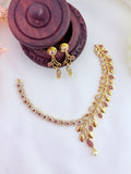 Classic floral and leaf pattern beautifully crafted with AD stones and pearl drops