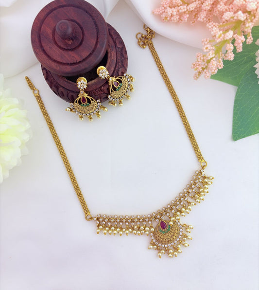 Beautifully crafted with AD stones and pearl drops - Premium matte finish neckset