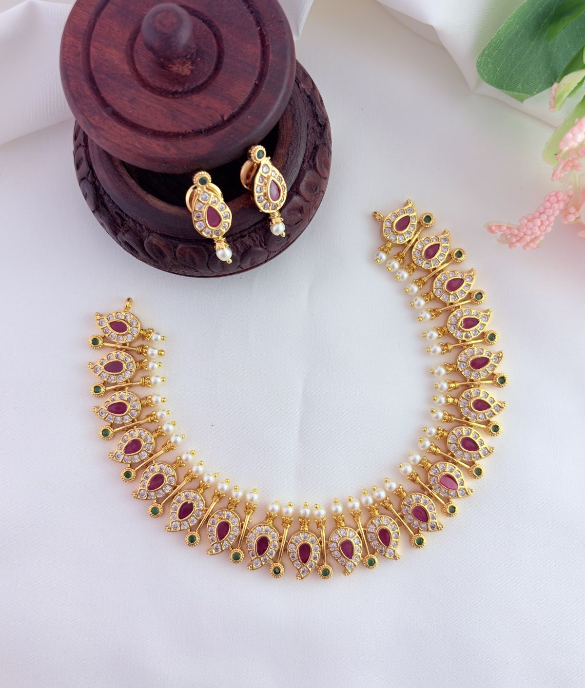 Elegant mango pattern neckset beautifully crafted with AD stones and pearls