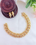 Elegant mango pattern neckset beautifully crafted with AD stones and pearls