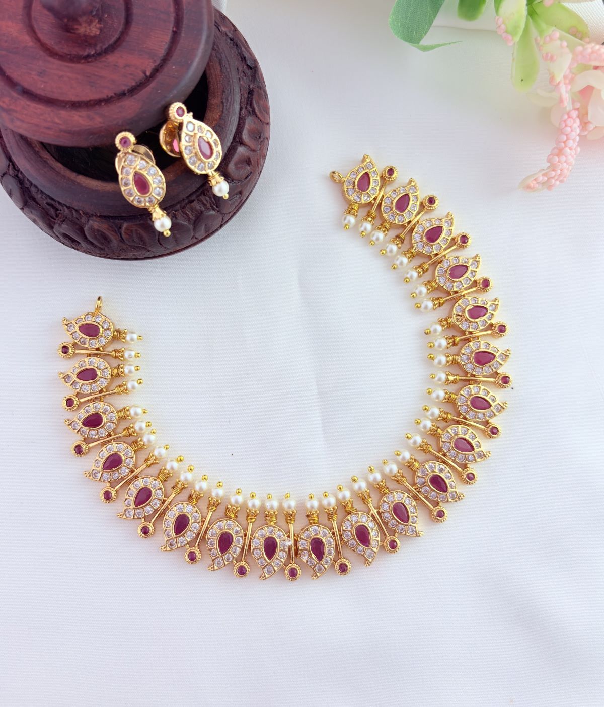 Elegant mango pattern neckset beautifully crafted with AD stones and pearls