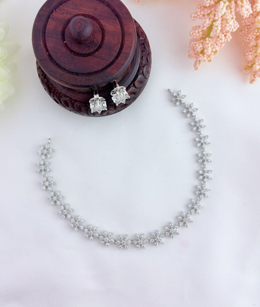 AD stone Neckset - Premium AD stone floral pattern neckset and earrings in silver finish
