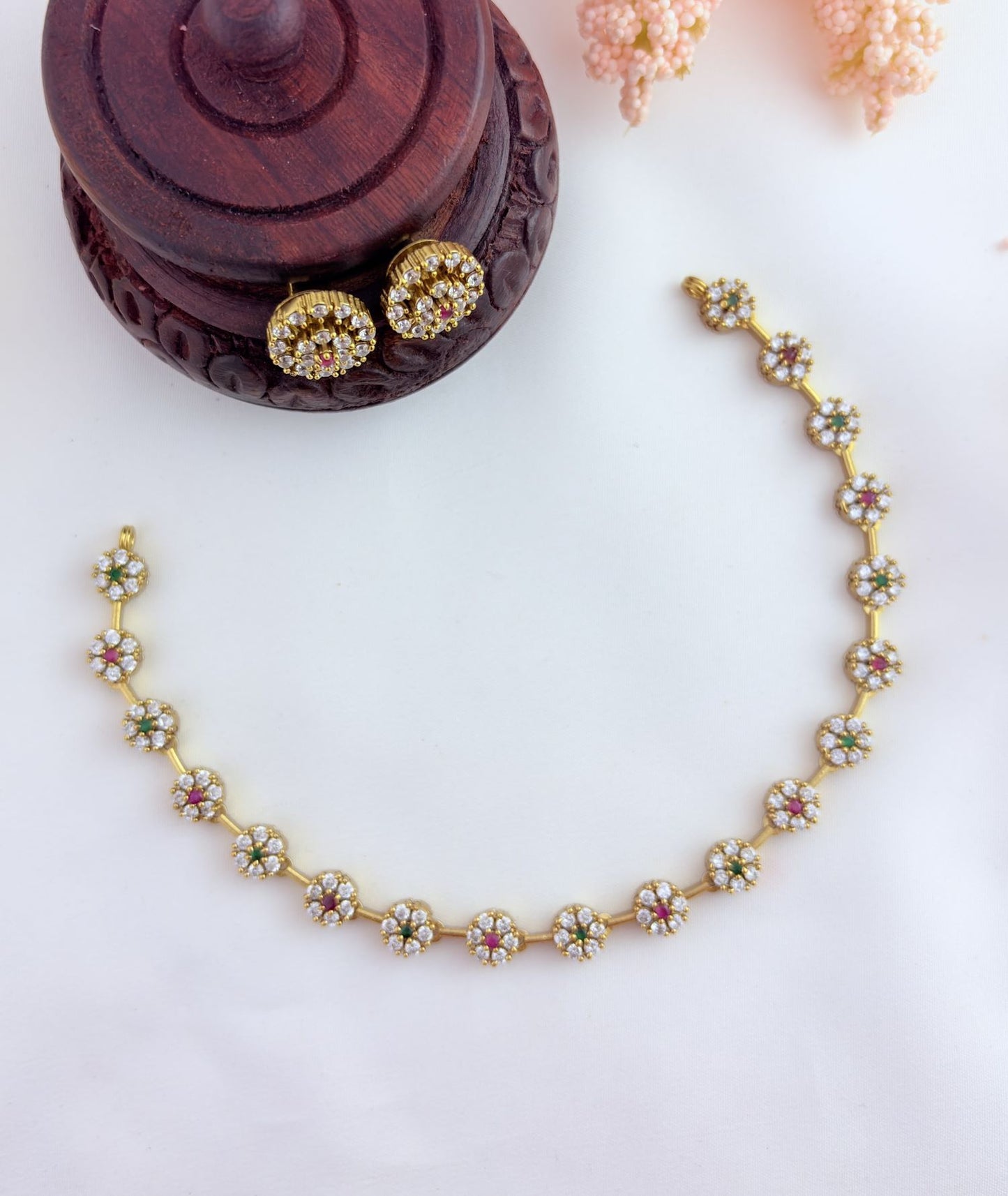 Perfect blend of tradition and elegance - Premium matte finish floral pattern AD stone neckset with matching earrings