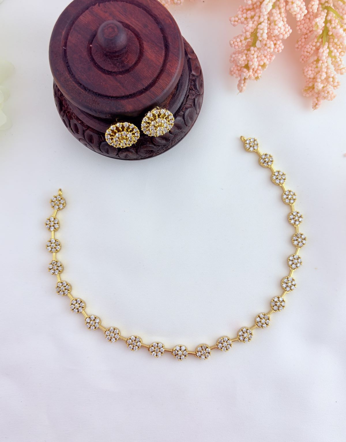 Perfect blend of tradition and elegance - Premium matte finish floral pattern AD stone neckset with matching earrings