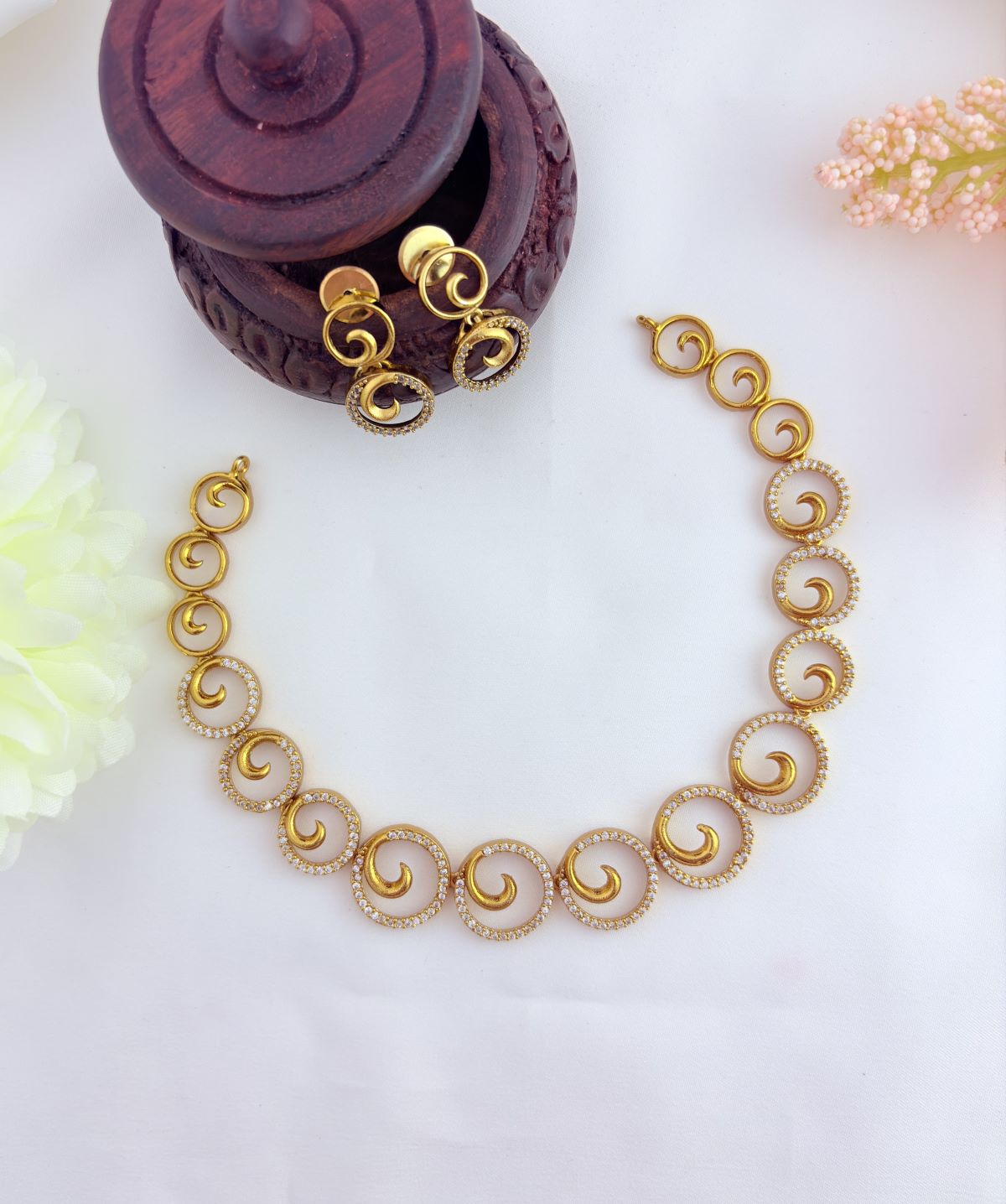 Beautifully crafted  AD stone neckset in premium matte finish with matching earrings