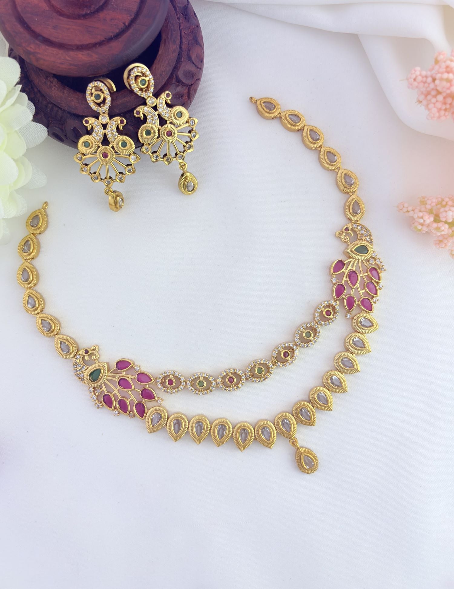 Intricate peacock motif crafted for a royal appearance - Premium matte finish neckset with matching earrings