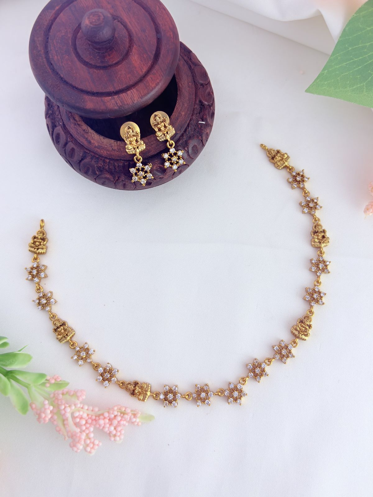 Traditional lakshmi motif neckset crafted with elegant AD stone embellishments