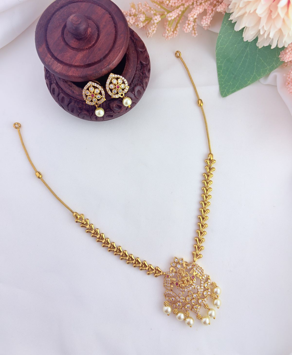 Premium minimal lakshmi motif neckset featuring sparkling AD stone detailing